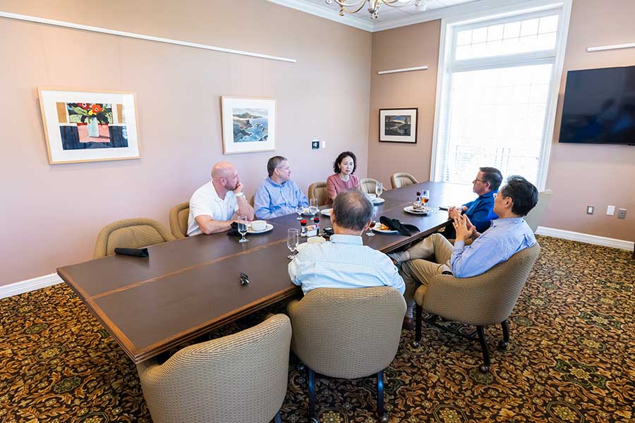 A group of people in a meeting