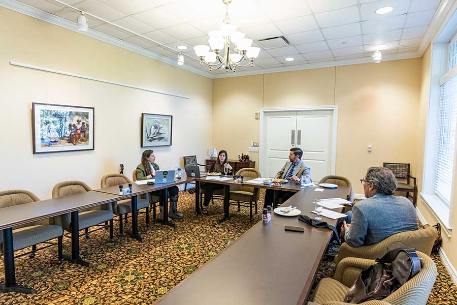 People around a table in a meeting