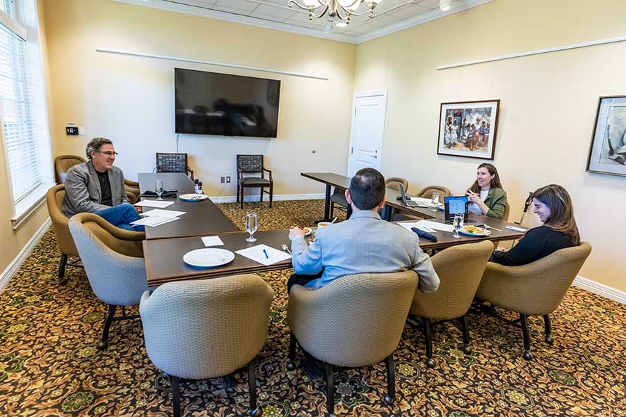 People around a table in a meeting